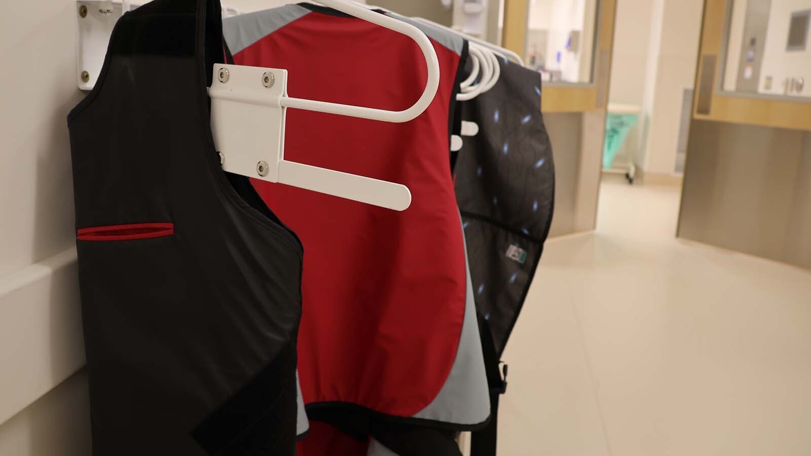 Lead vests hang outside the doorway of the EP lab. Everyone who works inside the lab wears a vest to protect them from radiation during a procedure.