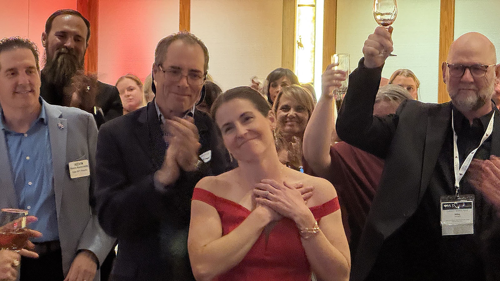 Mandy Fabel, executive director of Leadership Wyoming, stands during a standing ovation during Leadership Wyoming's 25th Anniversary celebration in Laramie.