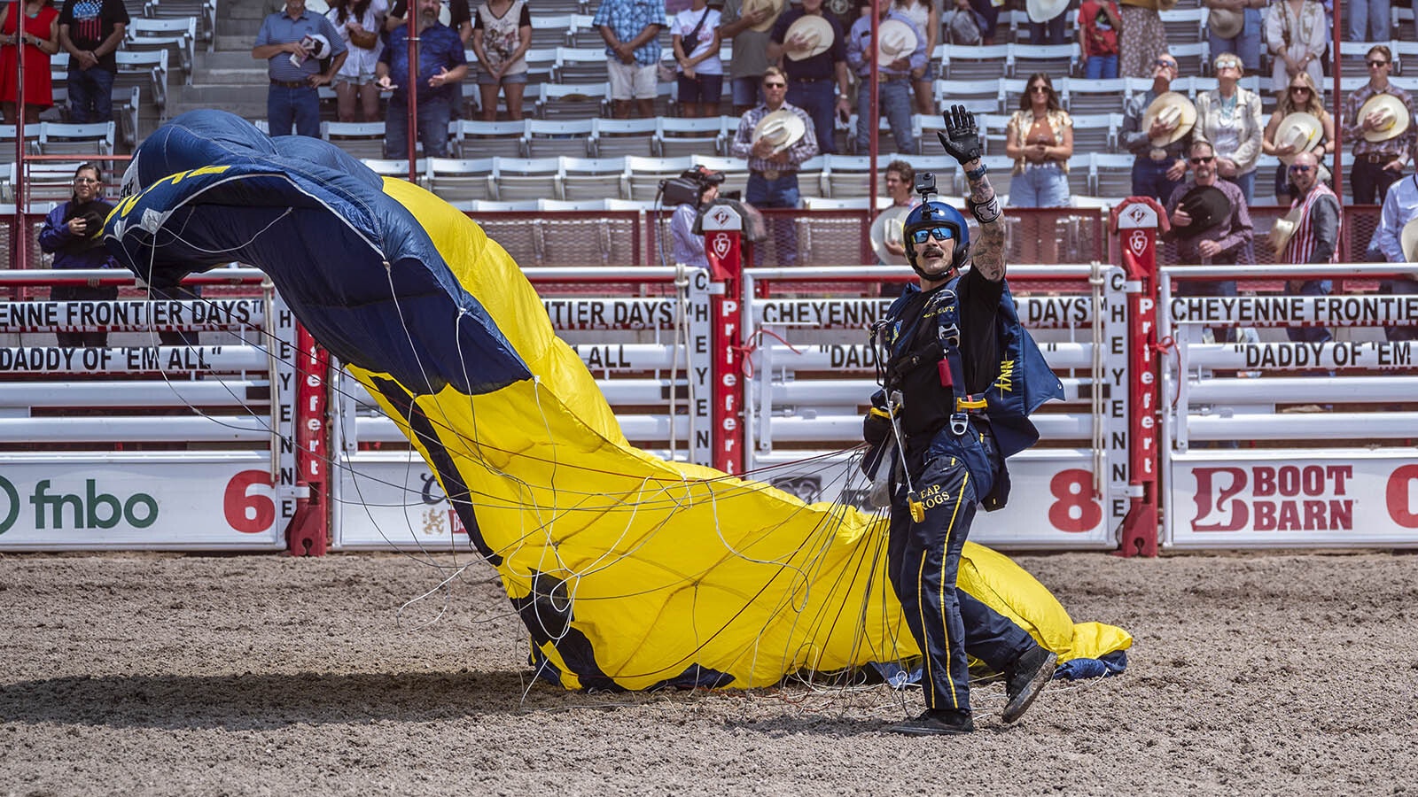 The elite Navy SEAL parachute team Leap Frogs has made a tradition of jumping into the Cheyenne Frontier Days Arena before rodeo performances. The team members then spend time visiting with the public.