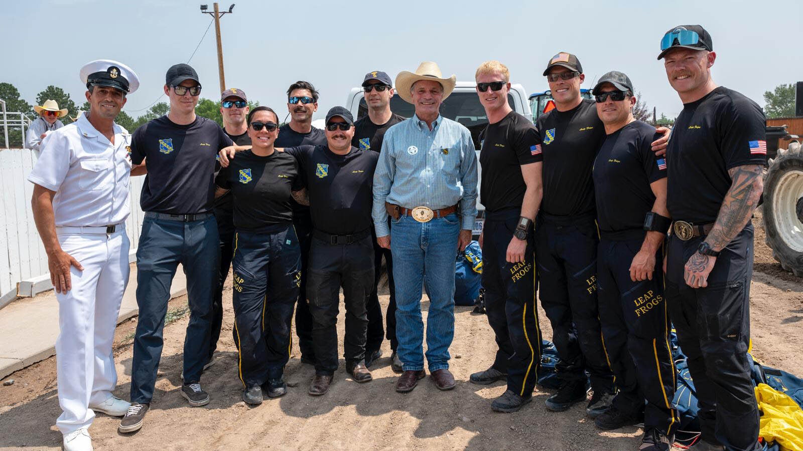 The elite Navy SEAL parachute team Leap Frogs has made a tradition of jumping into the Cheyenne Frontier Days Arena before rodeo performances. The team members then spend time visiting with the public.