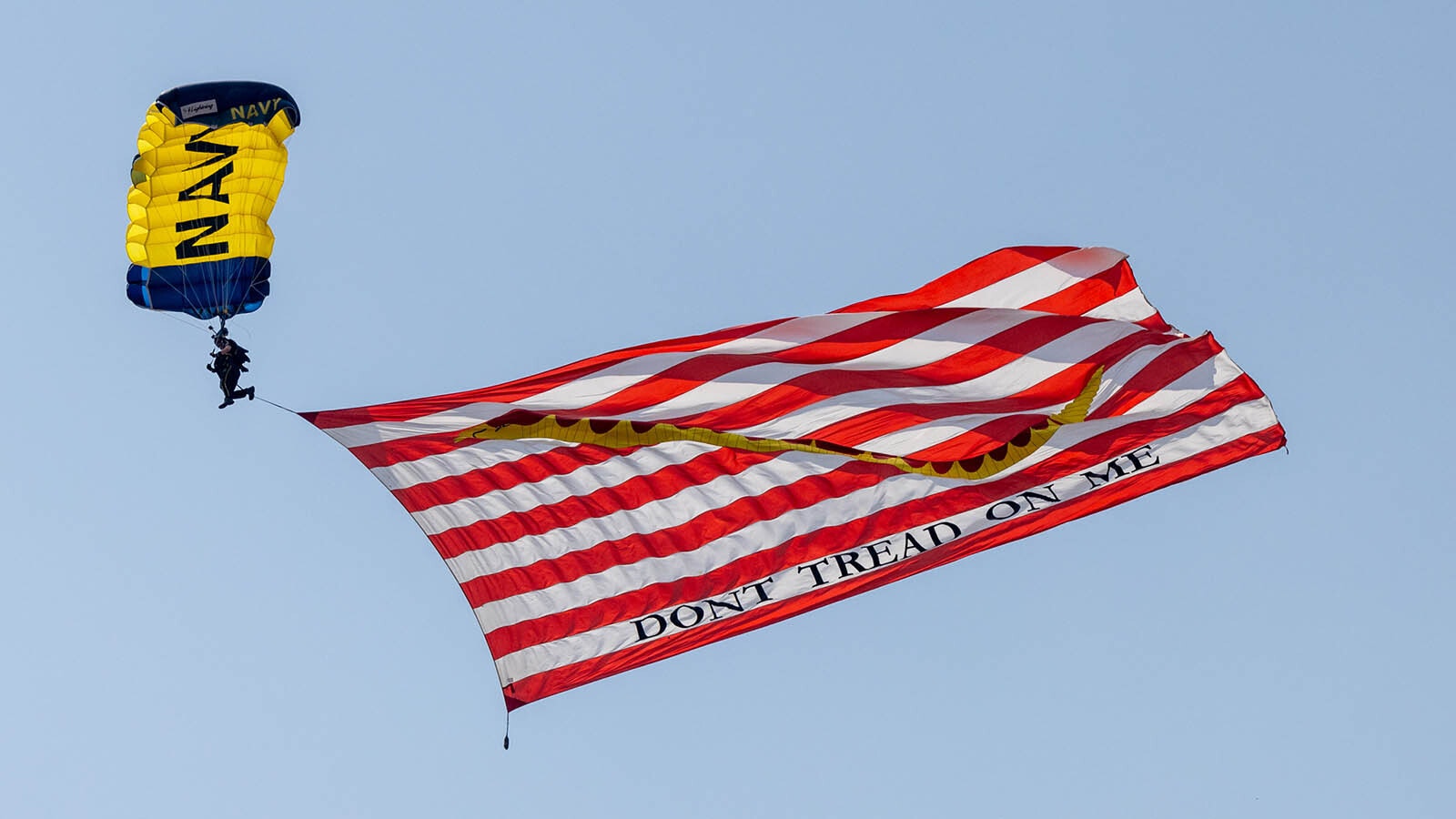 The Navy Leap Frog parachute team always gets a huge crowd pop when it drops in from thousands of feet in the air with a huge American flag.