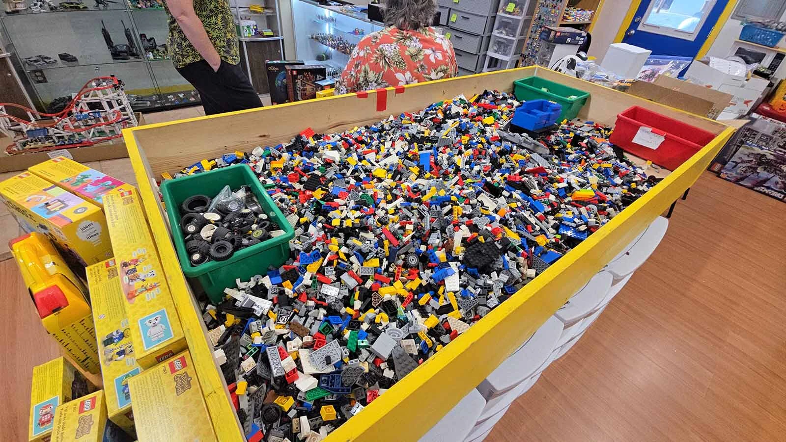 This big bin of random LEGO pieces is a popular spot in the store. Customers use it to find pieces that fit custom LEGO projects.