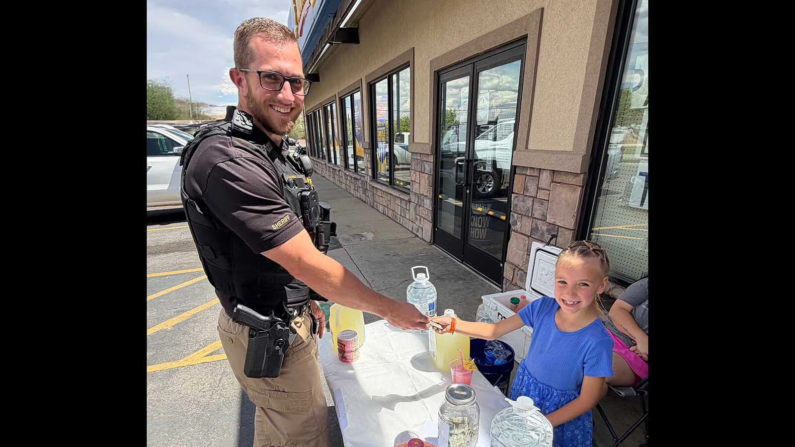 Maelie Teuscher, 6, is one of the Sweetwater County kids getting some brisk business from thirsty Sweetwater County Sheriff's Office deputies this summer.