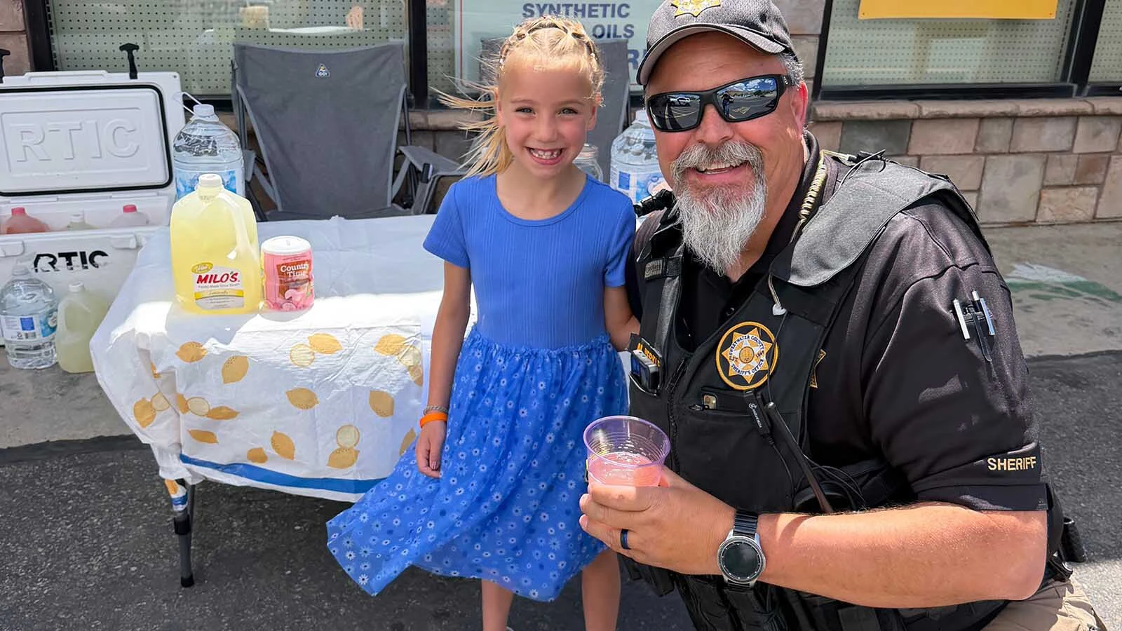 Maelie Teuscher, 6, is one of the Sweetwater County kids getting some brisk business from thirsty Sweetwater County Sheriff's Office deputies this summer.