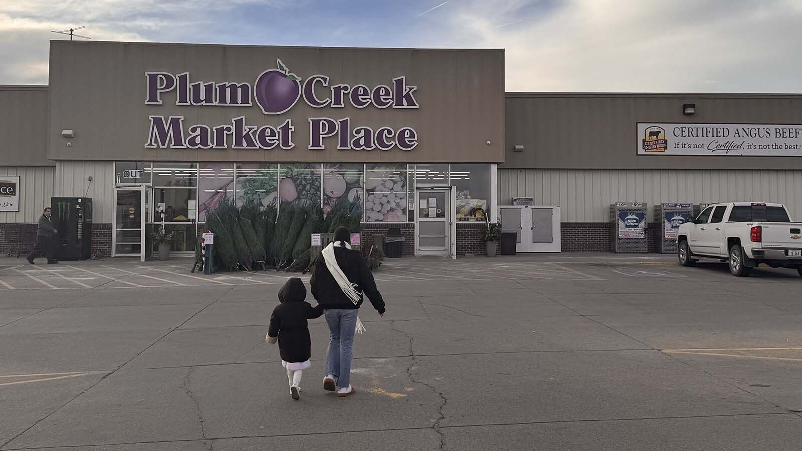 Fernada Rodriguez walks into Plum Creek Market Place. She said her entire family depends on the Tyson plant. Her father worked there for 35 years, and her aunts, uncles and brothers-in-law all still work there.