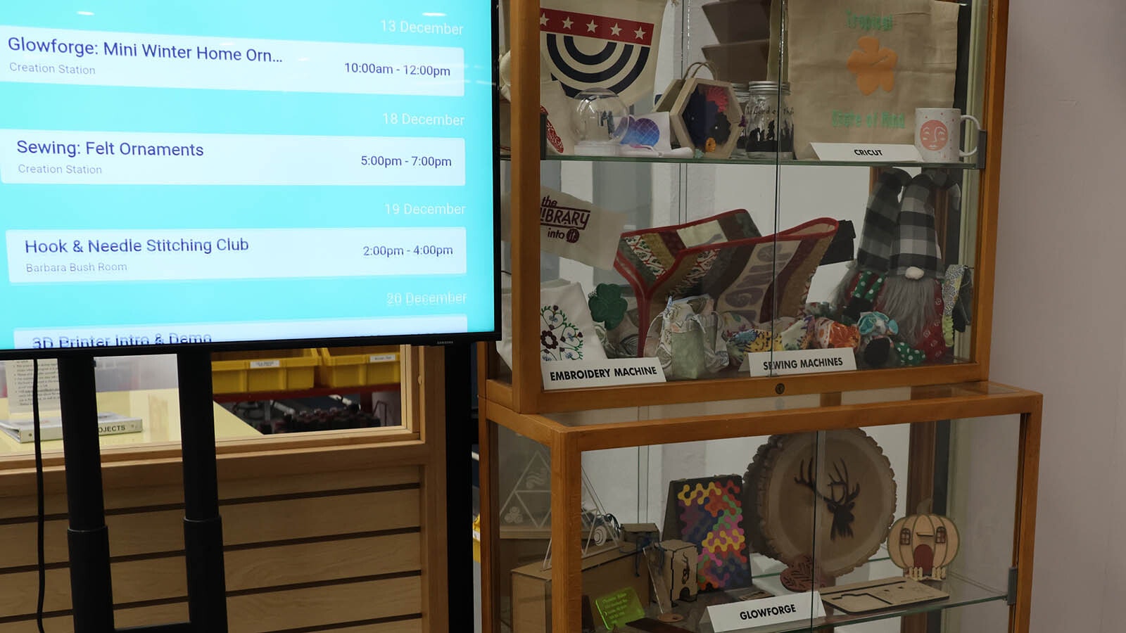 A cabinet outside the Creation Station features items that can be made with the equipment available for patrons.