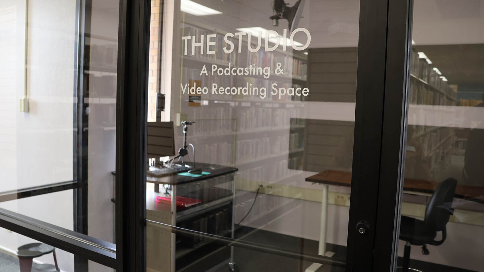 A studio room on the second floor of the Natrona County Library can be reserved to record and edit a commercial or podcast. The room offers different backgrounds for the camera, including a green screen that allows for another video background to be inserted during the editing process.