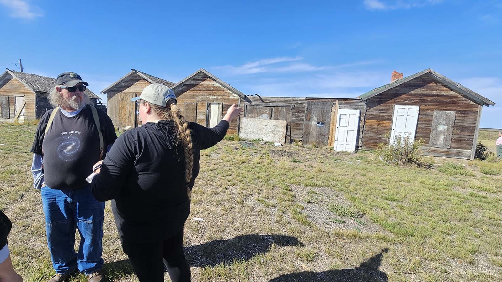 Megan Stanfill, right, talks about the tourist court in Bosler during the Alliance for Historic Wyoming's Lincoln Highway "Unbarred" tour.
