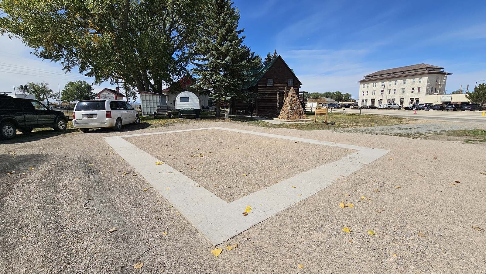 This is where the Fossil Cabin will move to in Medicine Bow. The Virginian Hotel is seen in the background, one more of the many sights along the way during the Alliance for Historic Wyoming's Lincoln Highway "Unbarred" tour.
