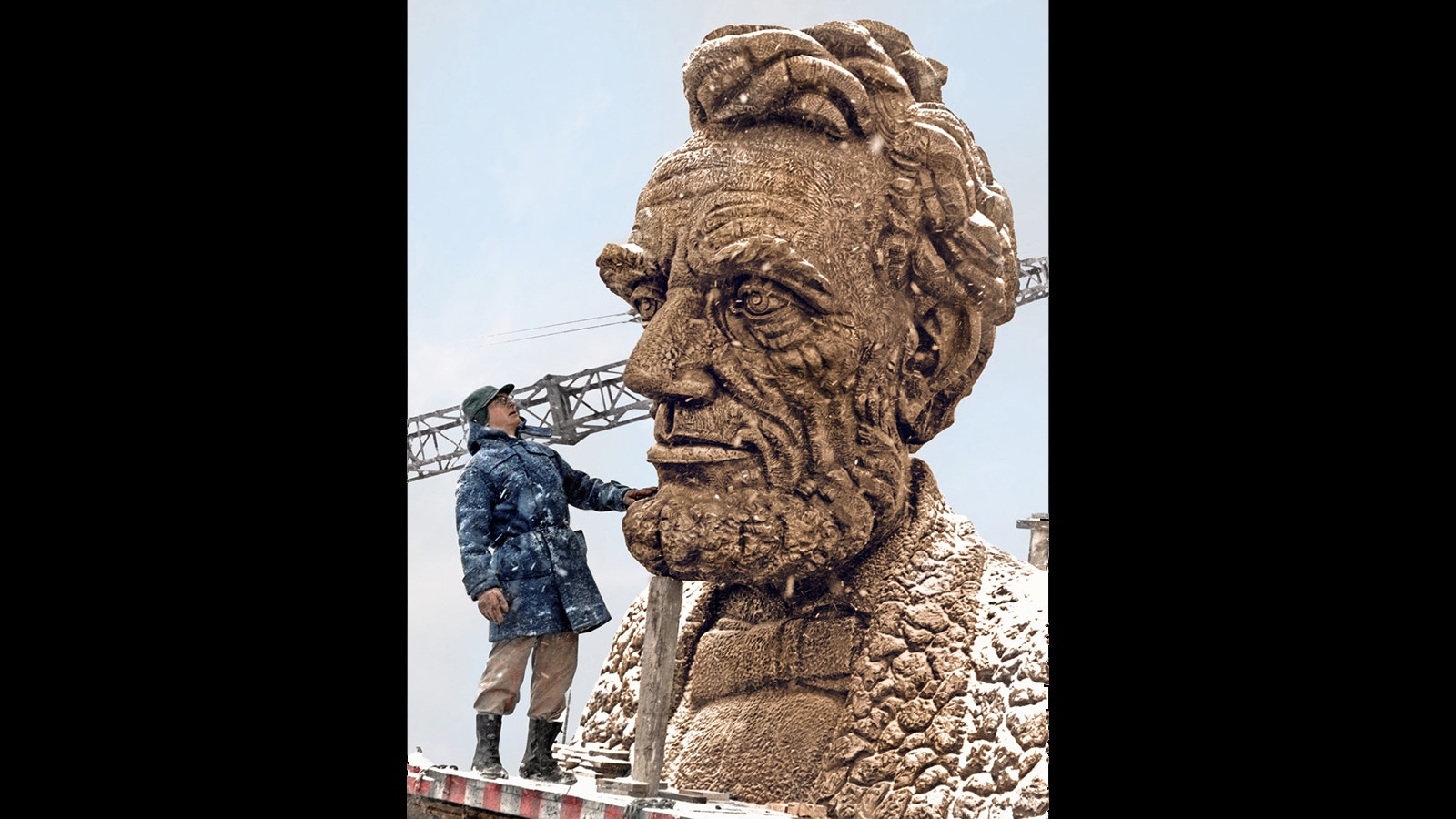 Wyoming artist Robert Russin with the giant bust of Abraham Lincoln he designed. The 12.5-foot bust was placed on a 30-foot pillar of granite and now sits at the top of Sherman Hill along Interstate 80 just east of Laramie.