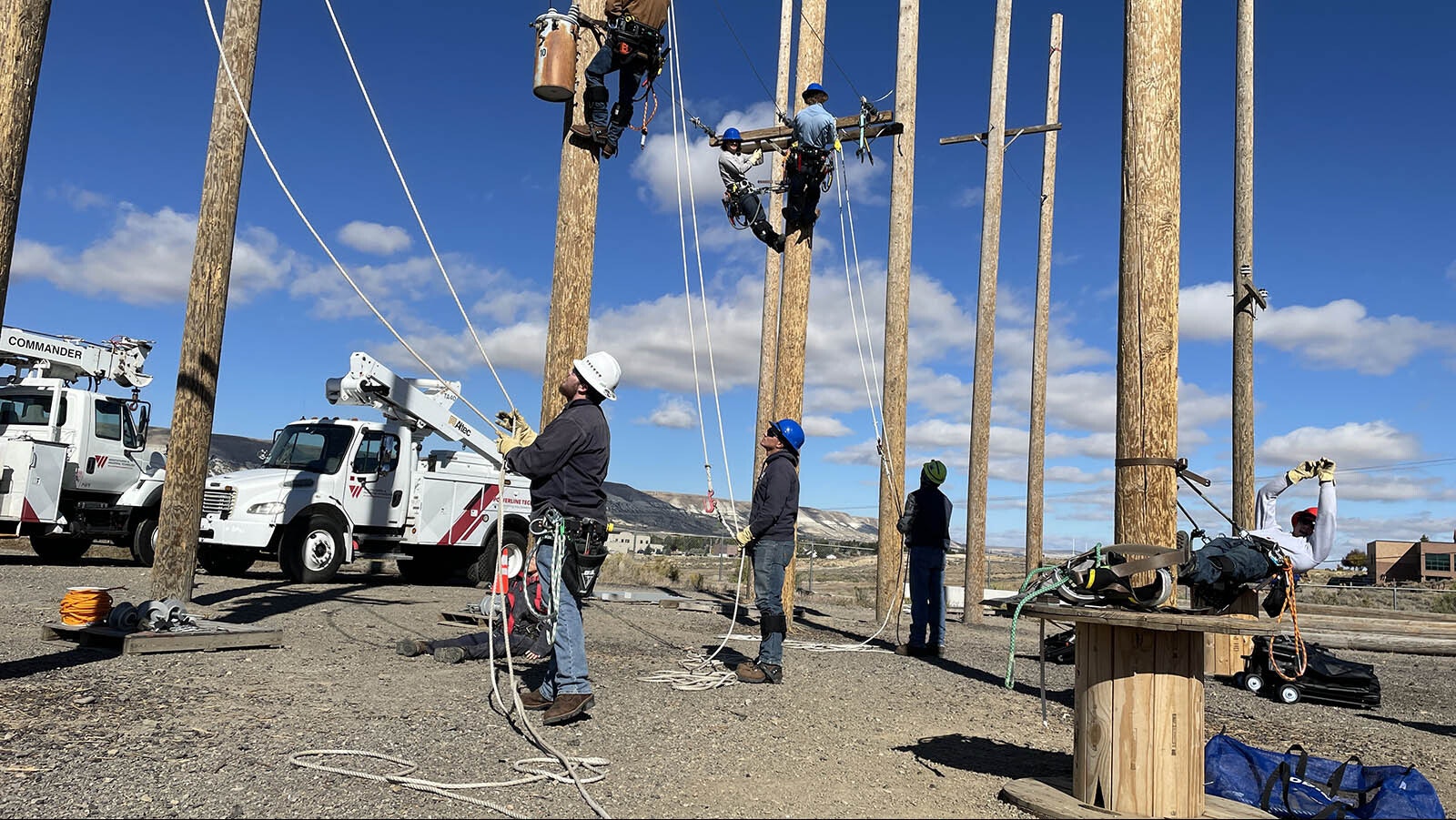 Students work with Rocky Mountain Power employees while learning to be electrical linemen.