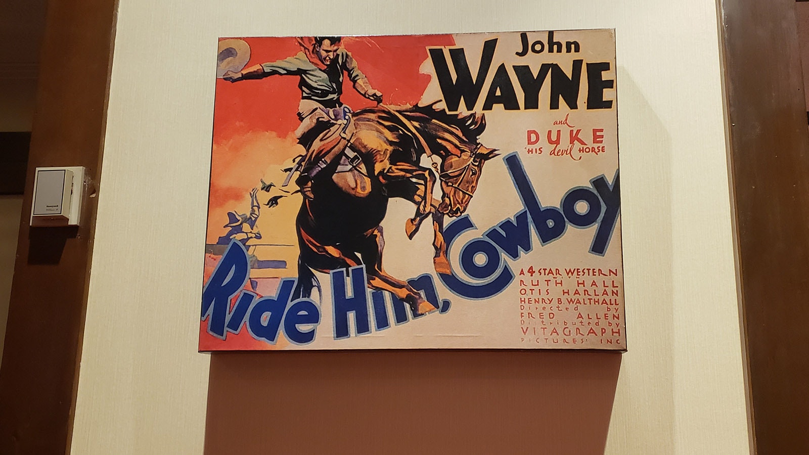 John Wayne is among the billboards hanging on the walls at Little America.