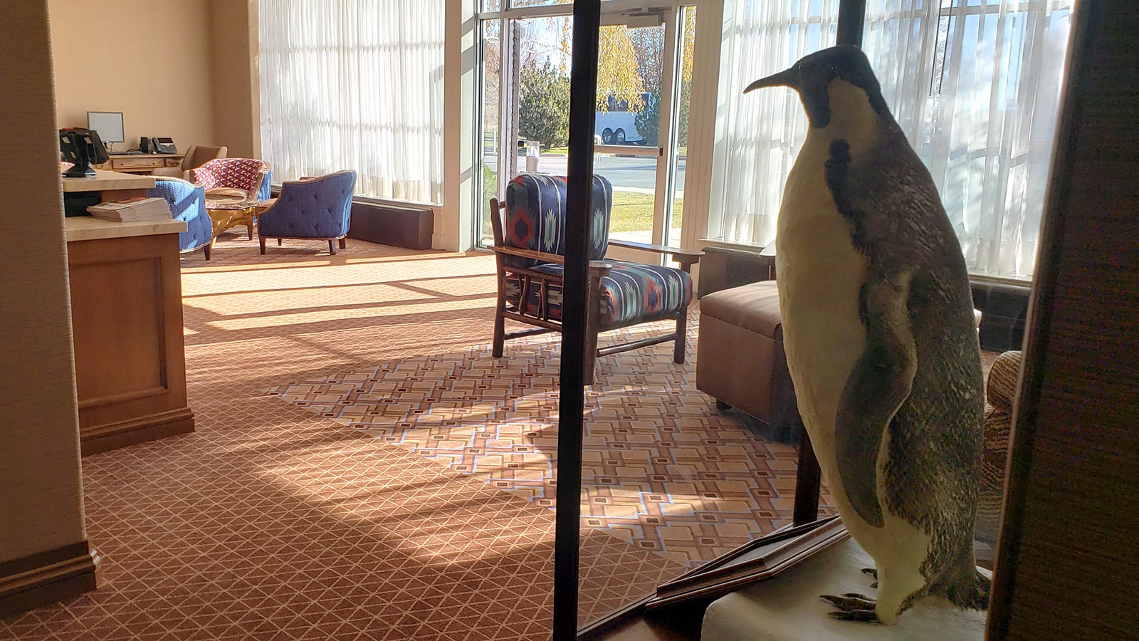 Little America's penguin mascot looks on from the hotel lobby.
