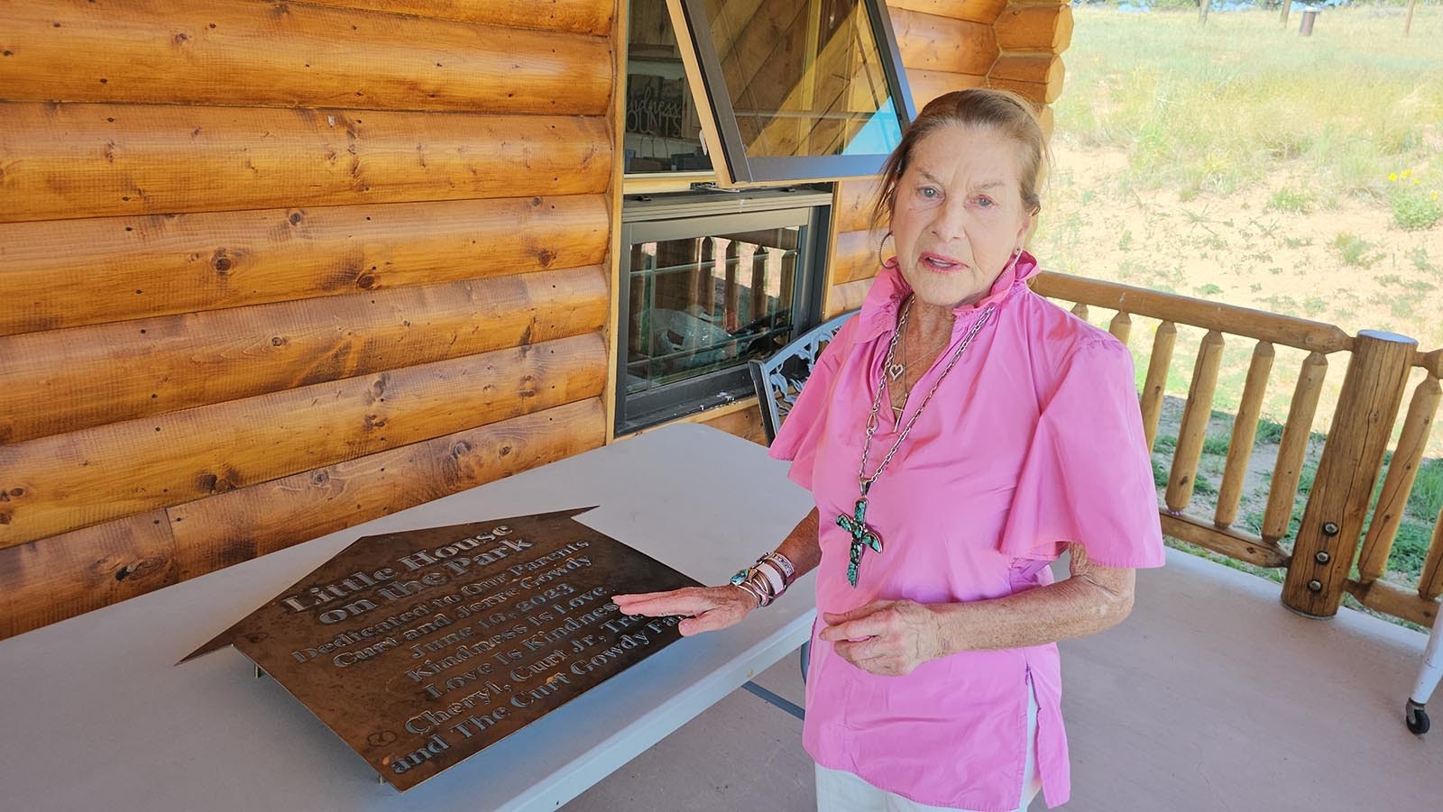 Cheryl Gowdy talks about a plaque she had made for Little House. She plans to take a photo of the plaque and frame it for her mother Jerre Gowdy's 100th birthday next month.