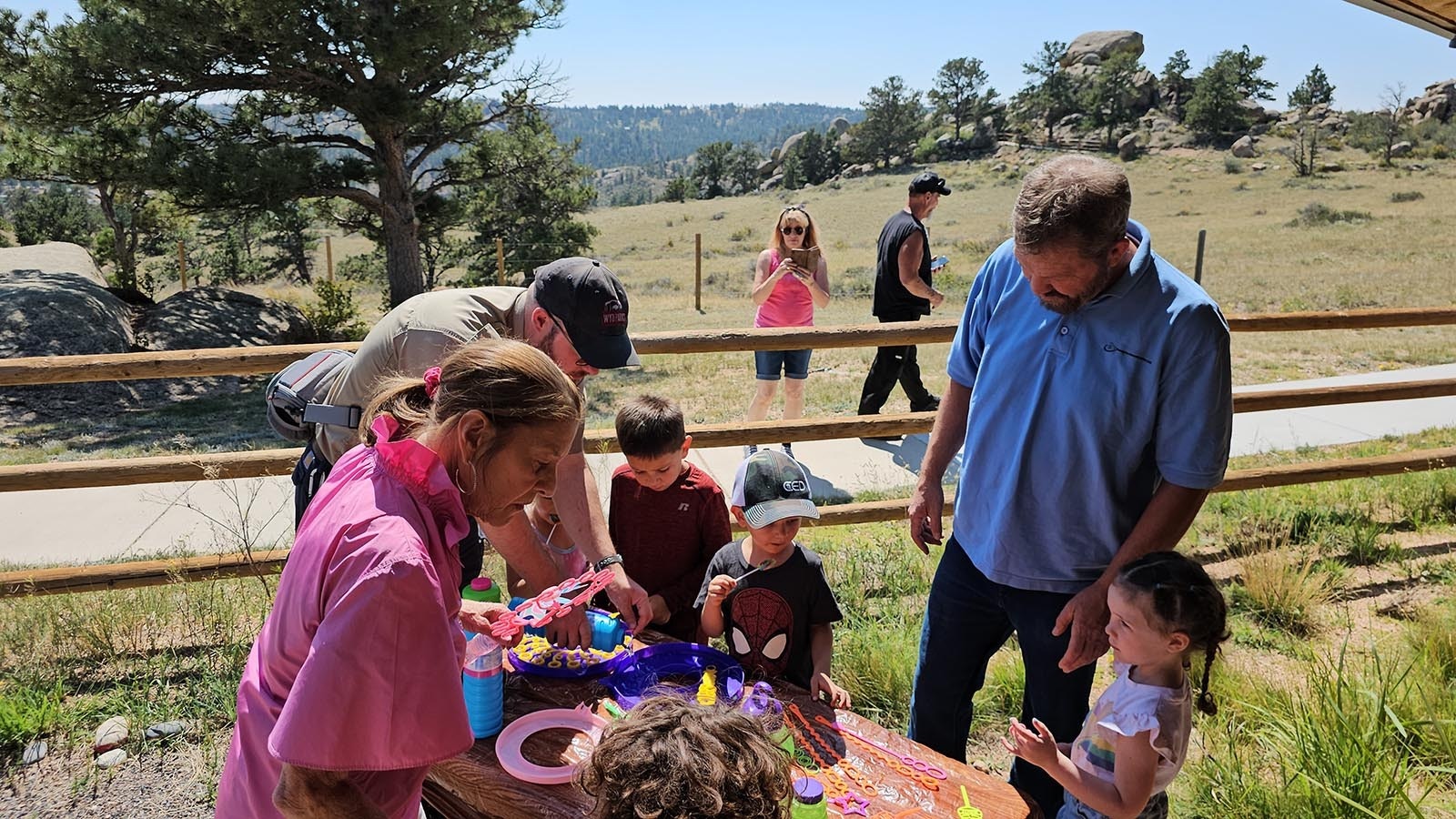 Cheryl Gowdy surrounded by children talks about Little House and its mission to spread kindness in the world.