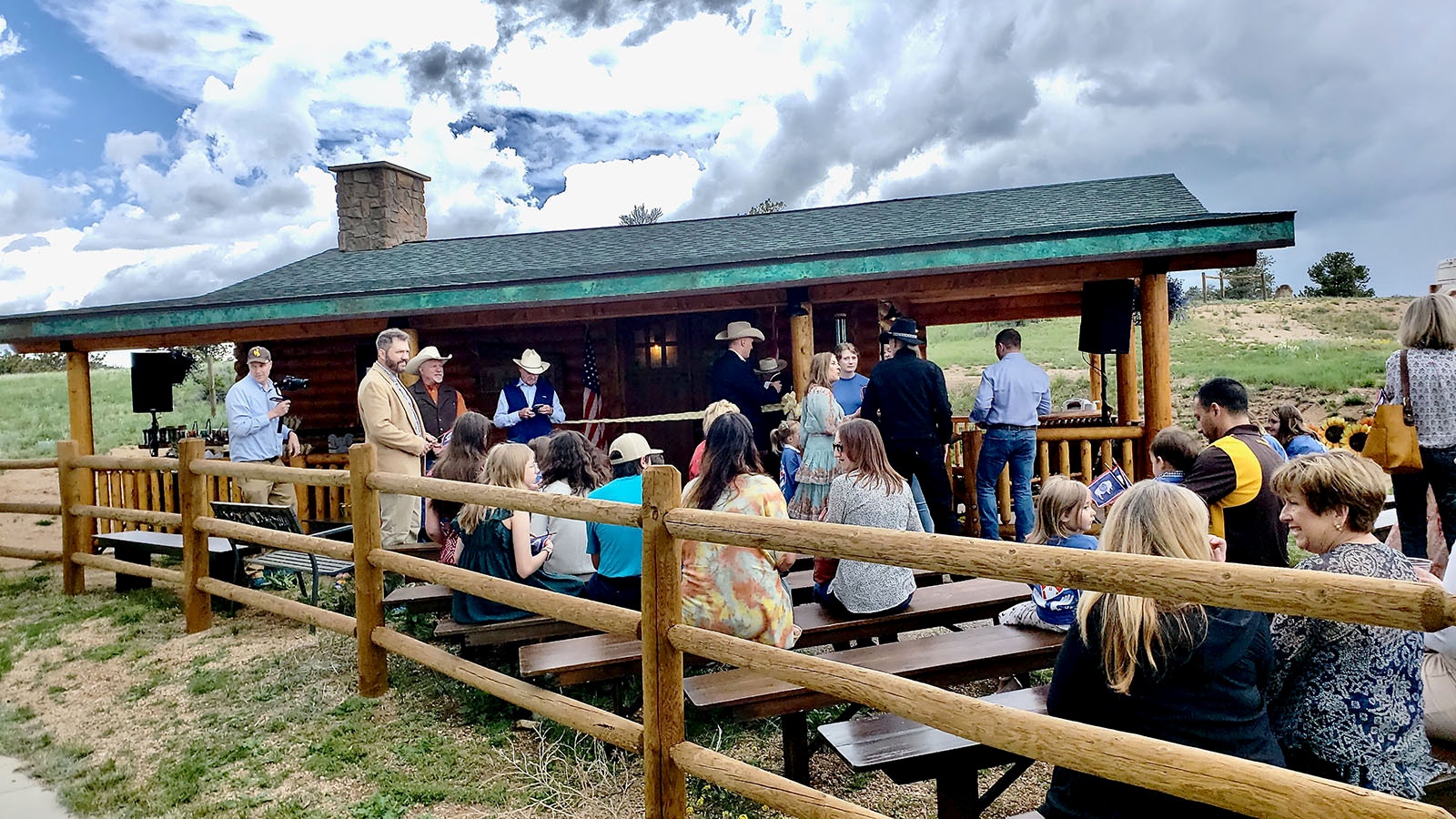 People gather at an open house for the new Little House on the Park at Curt Gowdy State Park.