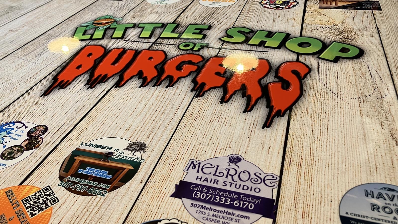Little Shop of Burgers’ tables all feature the restaurant’s name and the scary font for “burgers.”