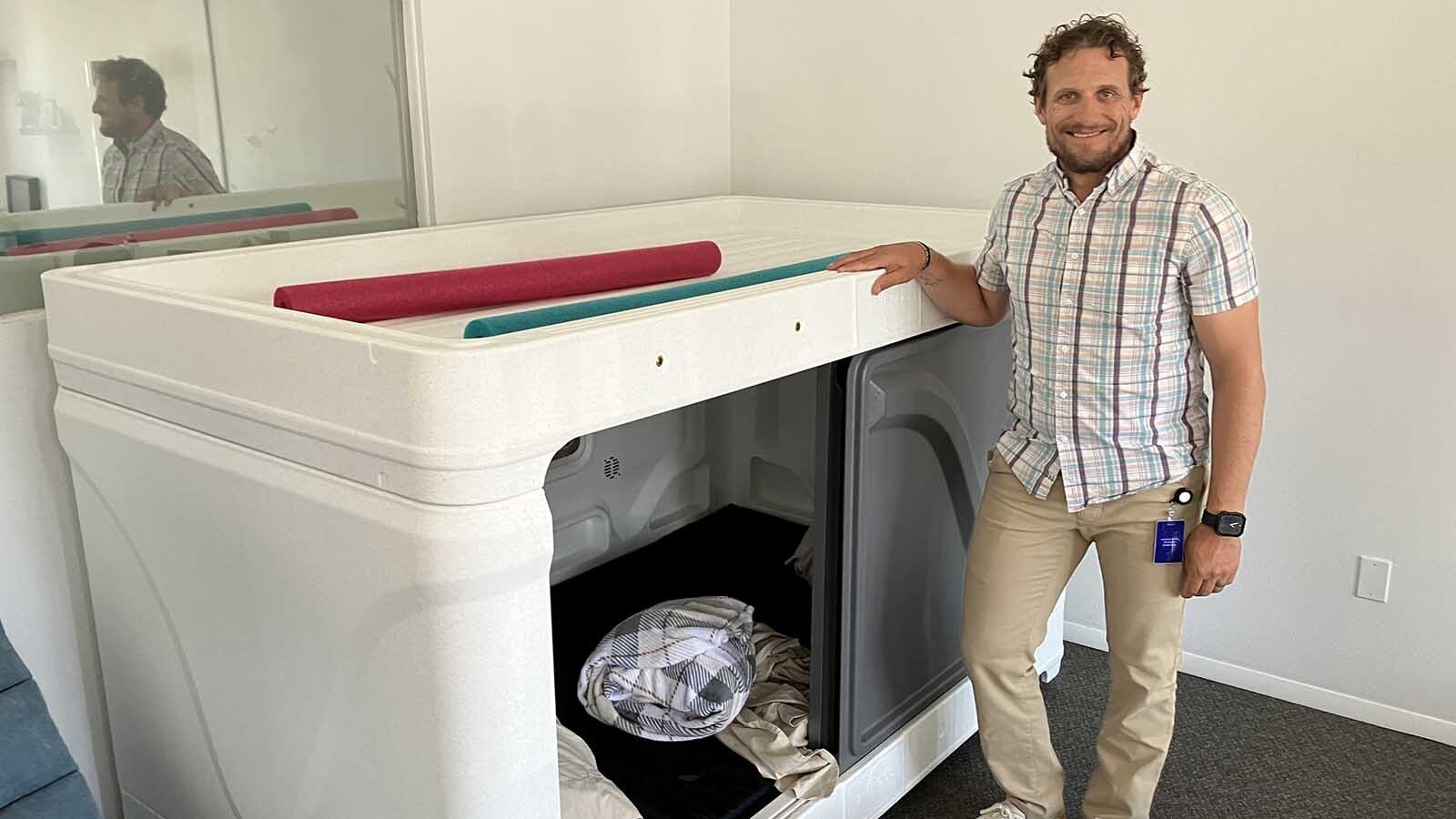 Live Inspired owner Nick Dillon stands by a sleeping pod designed to help clients with autism learn how to sleep.