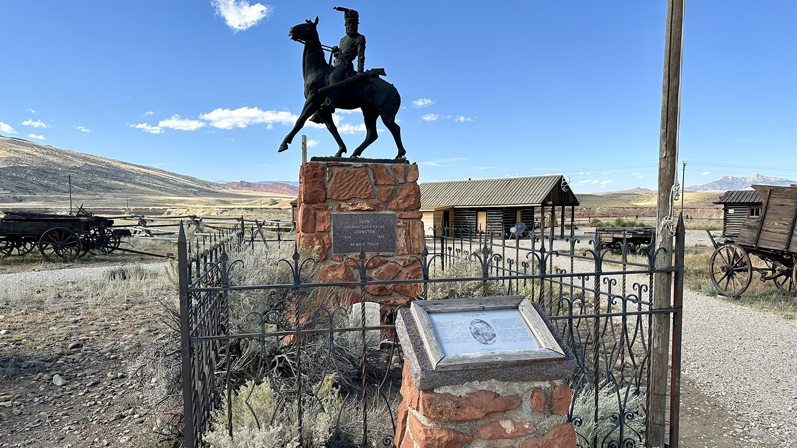 The remains of John "Liver-Eating" Johnson are marked in Old Trail town by a large marker and a sculpture of him. And he's not going anywhere. After his burial, two trucks worth of concrete filled in the gravesite. Note the monument names him as "Jeremiah" Johnson because of the movie, which wasn't his true name.