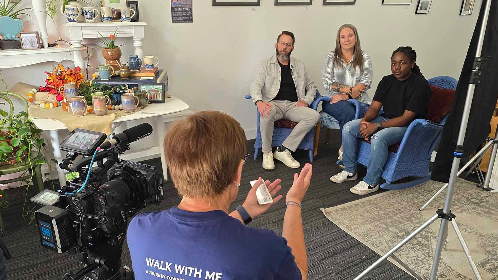 Lucy Rose talks with Savannah Levett and her adopted family, Stan and Maggie Hartzheim, about how the Adopt an Airman program at F.E. Warren. Levett, far right, said the program helped her overcome loneliness when she first moved to Cheyenne.
