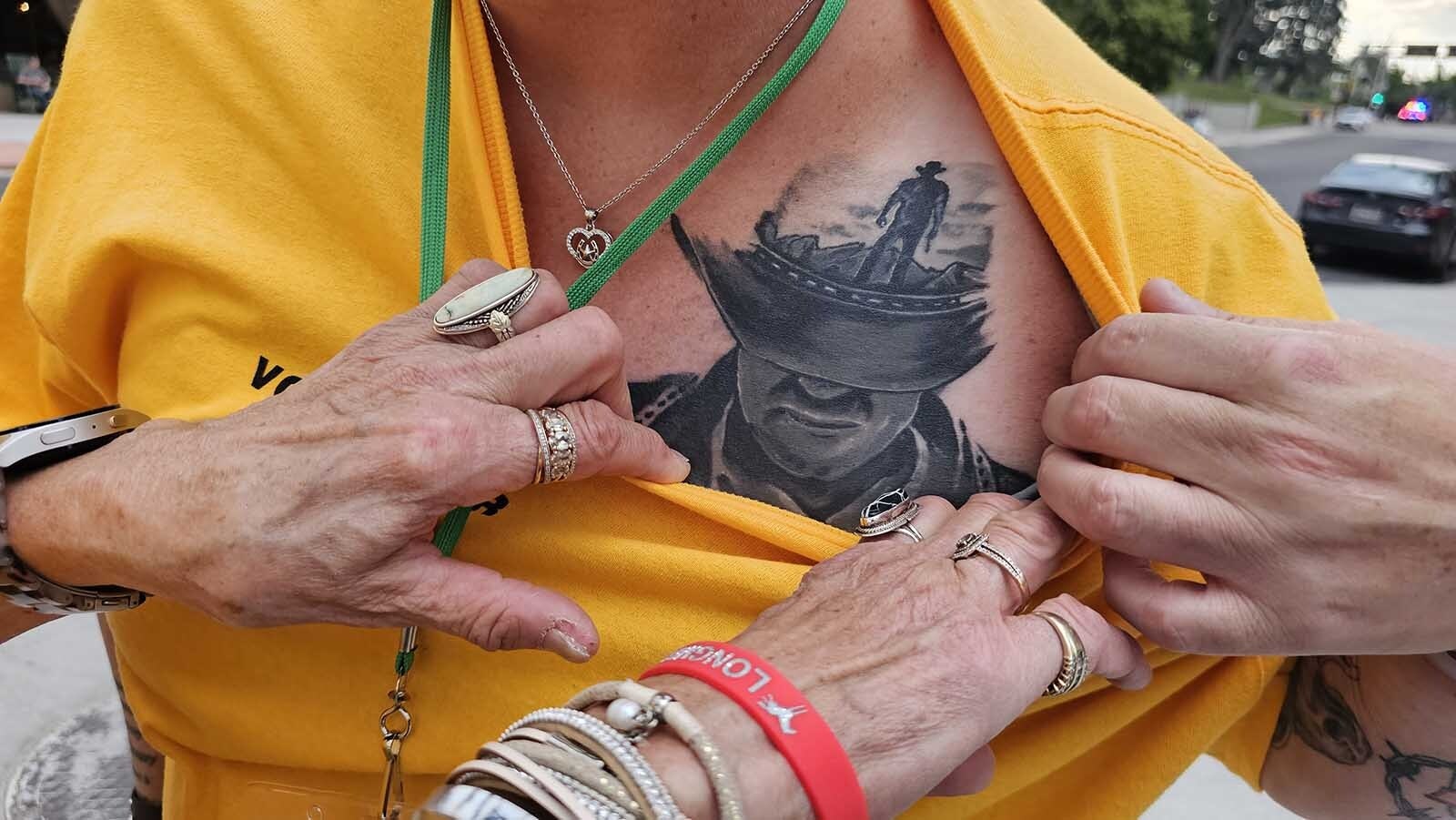 Janet Hartung shows off her latest Walt Longmire tattoo.