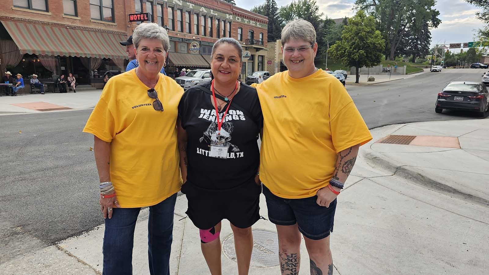 From left, Tammy Bachman, Robyn Salazar, and Janet Hartung are among people who help make Longmire Days in Buffalo happen. They feel like they have found an extended family in the vent, which offers a yearly respite from the cares of the world.