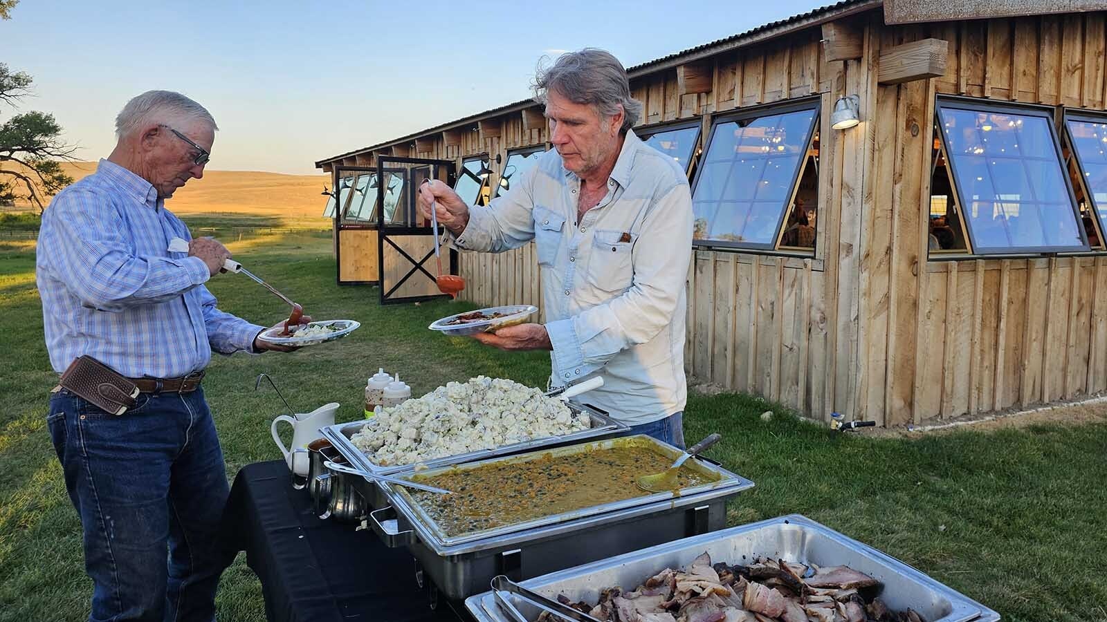 Robert Taylor prepares a chuckwagon plate with prime rib, baked beans and potato salad.