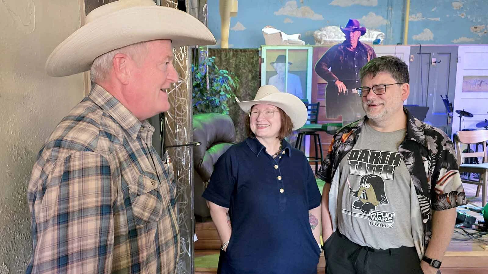Author Craig Johnson stops to talk with fans Terri Behm and Ken Dambrosio after the "Two Walts" panel during Longmire Days in Buffalo. Behm is wearing a King Ropes hat from King Saddlery in Sheridan.