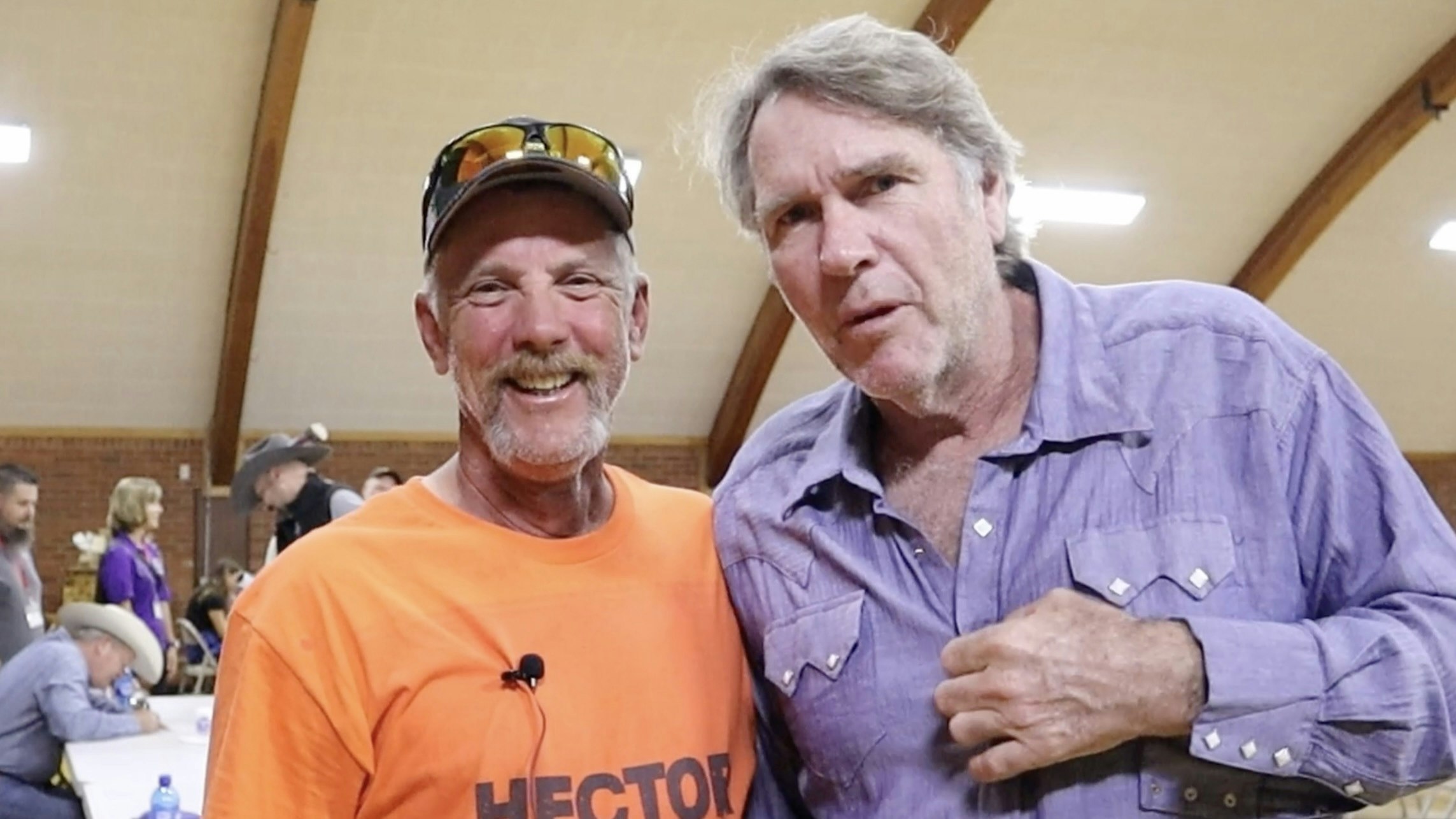 "Longmire" star Robert Taylor, right, mugs for the camera with a fan.