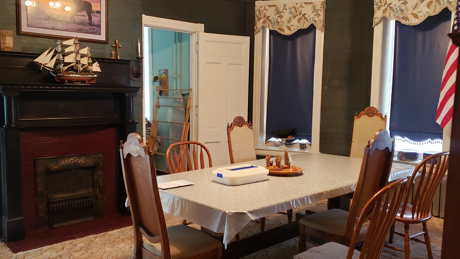 The dining room is much as it was when the house was completed in 1901, including the rice paper wallpaper.