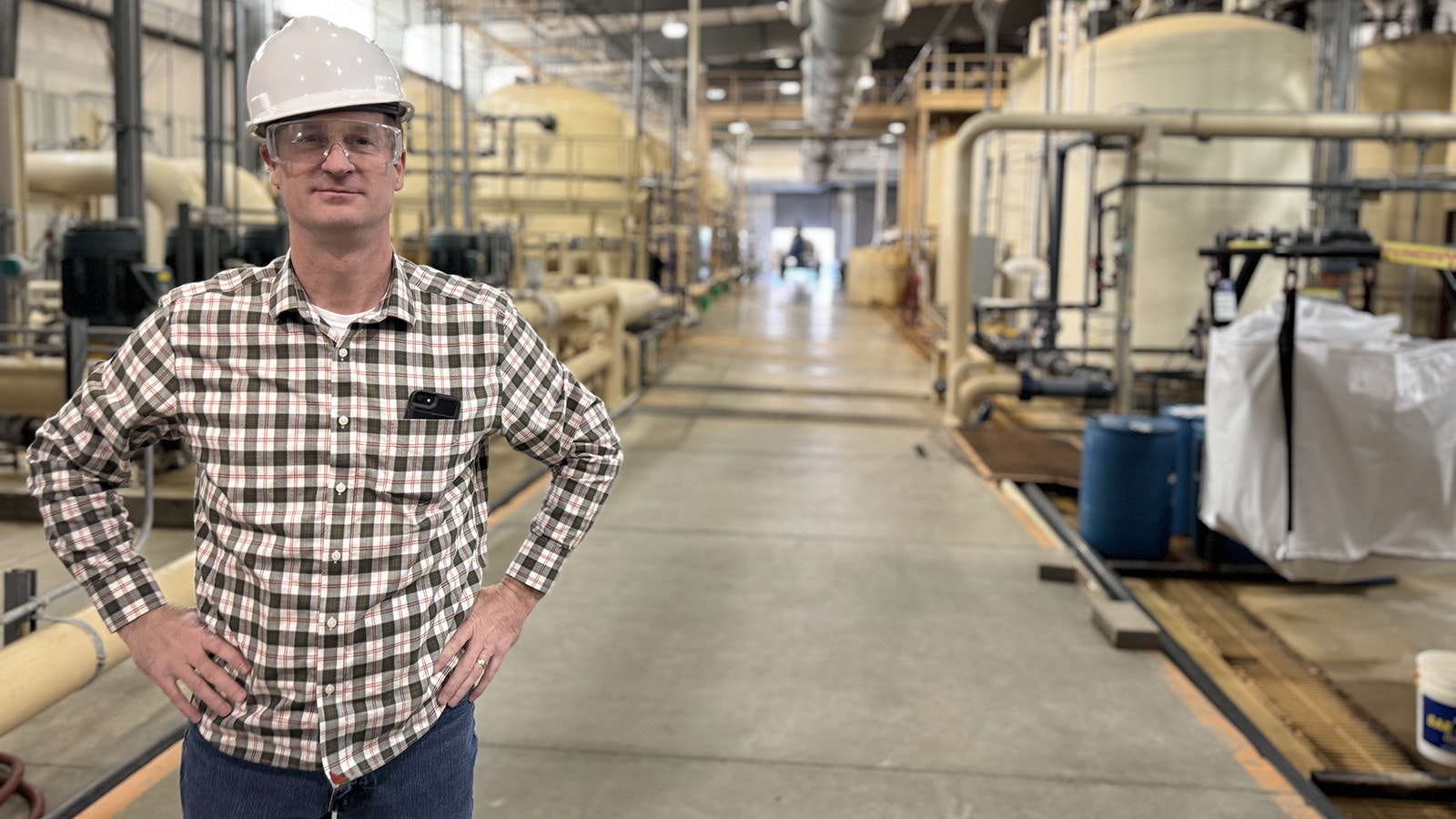 Ur-Energy CEO John Cash stands on the factory floor of his uranium processing facility used to turn mined uranium into yellowcake, a precursor to nuclear fuel made elsewhere.