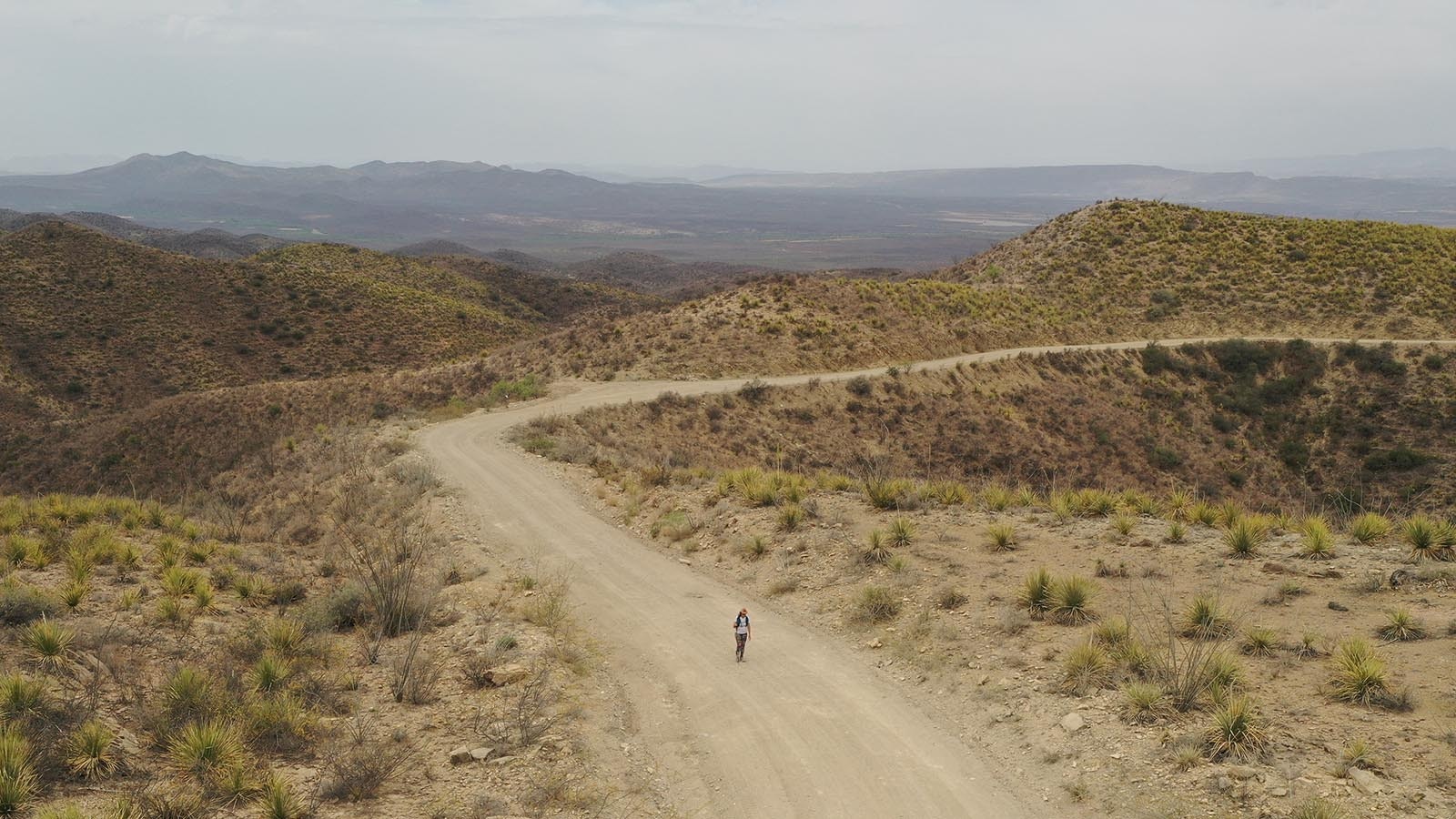 An aerial view of Lucy Barnard walking through Wyoming on her trek to hike the length of the earth, from the tip of South American to the top of North America.