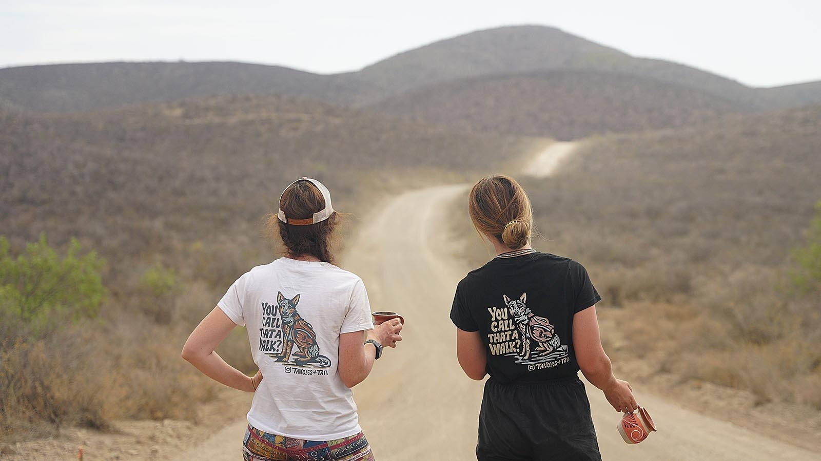 Lucy Barnard and a friend she made on the way survey the road ahead. Lucy has chronicled her journey to walk the length of the earth on her Instagram page, Tangles and Tails. She also has helped create several YouTube documentaries and guest starred on several podcasts.