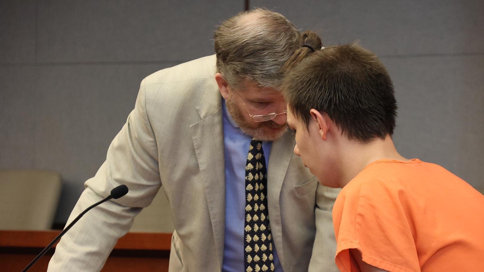 – Defense attorney Marty Scott confers with Luka Rasmussen, 18, during Rasmussen's preliminary hearing Thursday, Feb. 20, 2025.