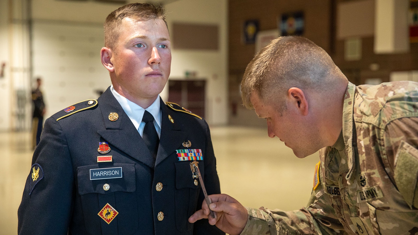 U.S. Army Spc. Luke Harrison, a field artillery radar operator assigned to the Wyoming Army National Guard, representing Region VI, stands at the position of attention while getting his uniform inspected at the 2023 National Guard Best Warrior Competition, Alaska, July 9, 2023.