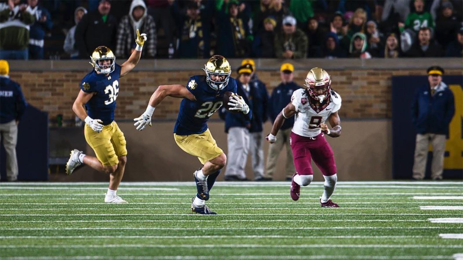 Luke Talich turns the ball upfield after making an interception against Florida State. He returned it for a touchdown, his first interception and touchdown playing for Notre Dame.