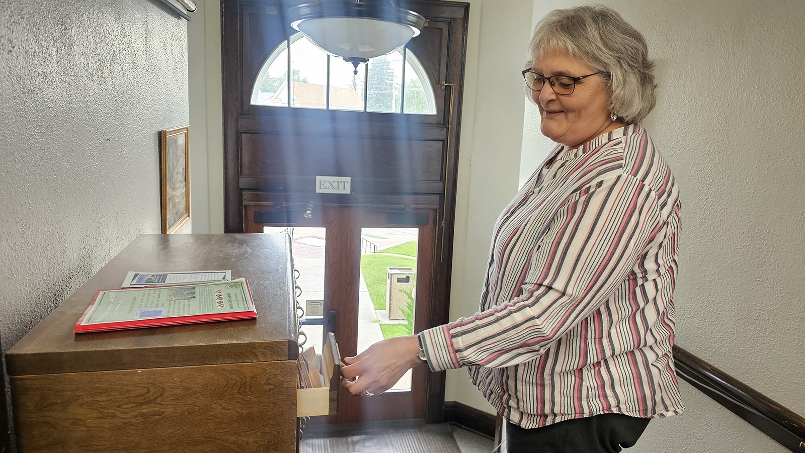 Librarian Debbie Sturman shows Cowboy State Daily the native plant seed library at the Niobrara County Library in Lusk.