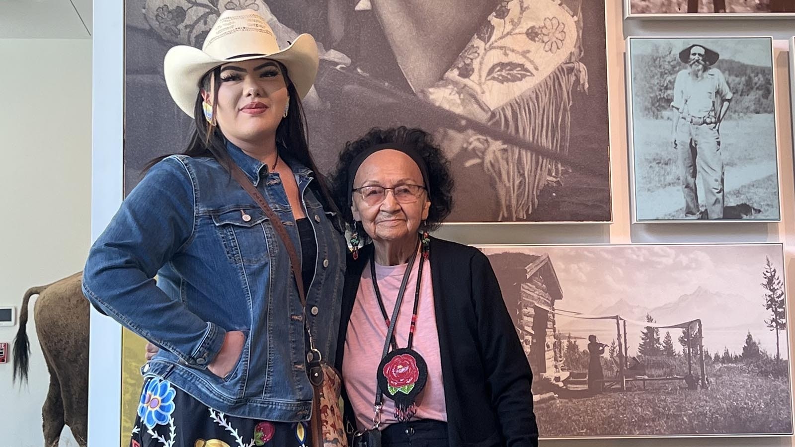 Generations preserving the Shoshone culture: Gabby St. Clair and Zella Tillman Guina pictured in front of Dick Washakie's image at the Jackson Hole History Museum.