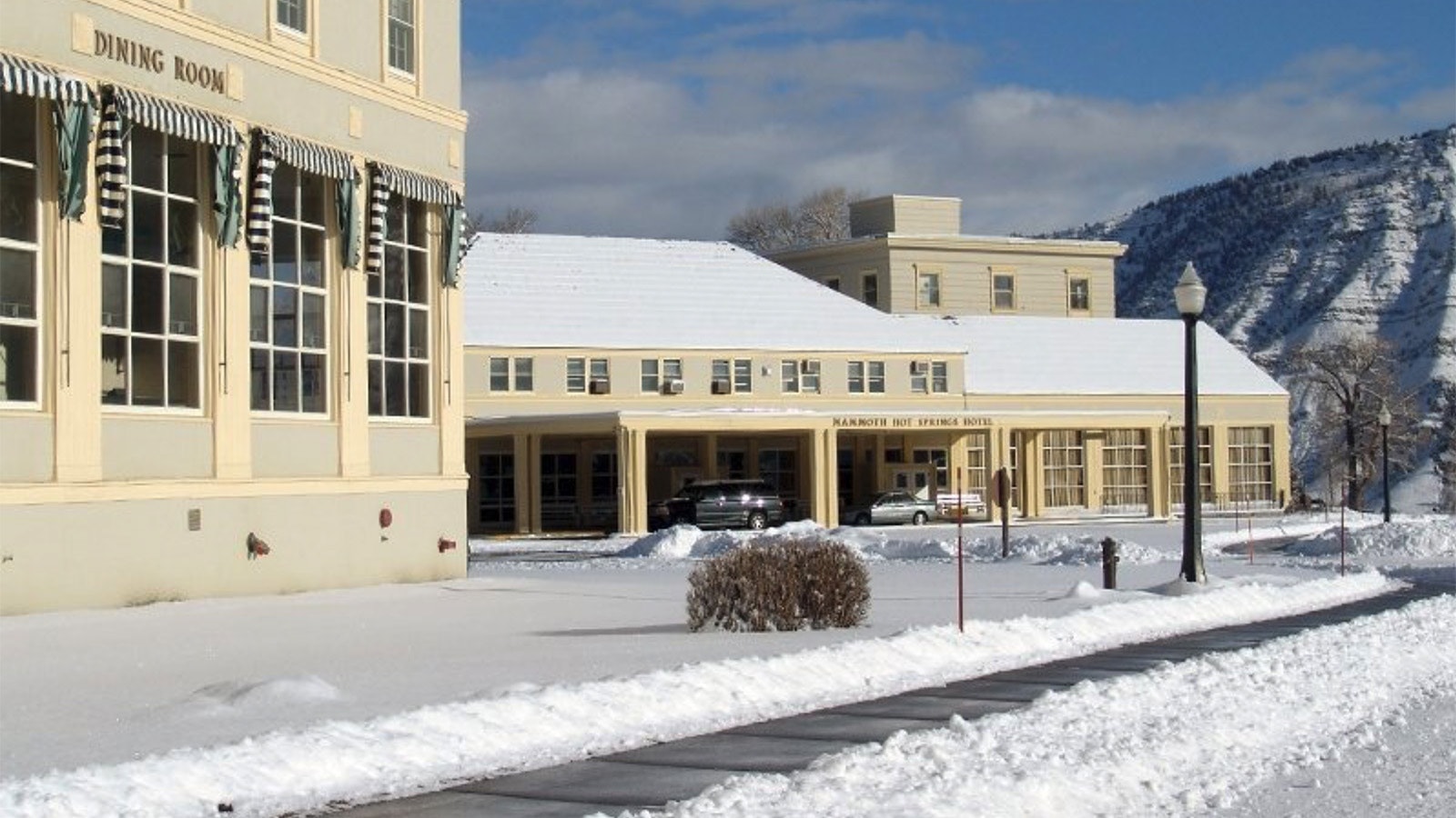 Colder temperatures and above-average snowfall have slowed progress on a new wastewater treatment system for the Mammoth Hot Springs Hotel, prompting the hotel to cancel its planned April 28 opening.