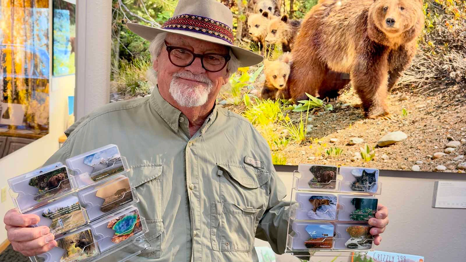Jackson-area photographer Tom Mangelsen displays some of the sleeves he's made to cover President Trump's face on "America The Beautiful" passes.