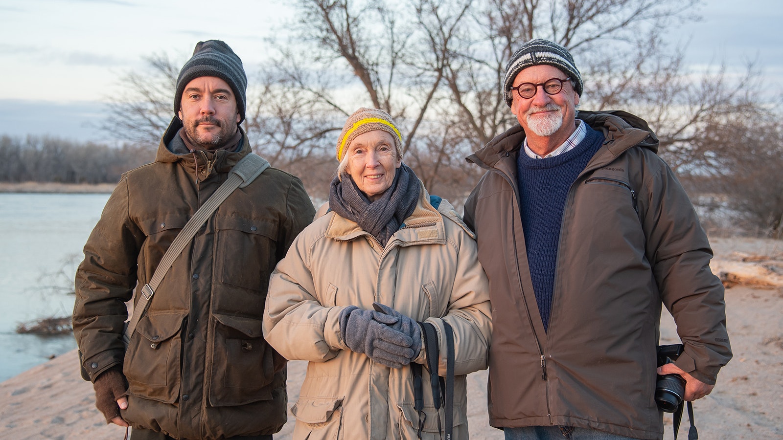 Legendary British primatologist Jane Goodall, popular musician Dave Matthews, left, and famed Wyoming wildlife photographer Tom Mangelsen wait for migrating cranes along the Platte River in Nebraska in 2017.