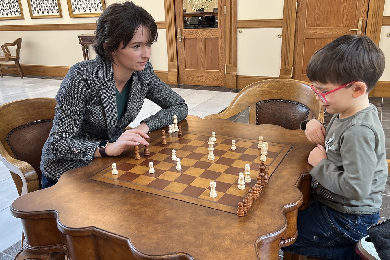 Cheyenne resident Marci Kindred, pictured here playing chess at the Wyoming Capitol during the 2023 legislative session, is forming a group to be an organized voice to fight efforts to ban and/or restrict controversial books and materials in Cheyenne school libraries.