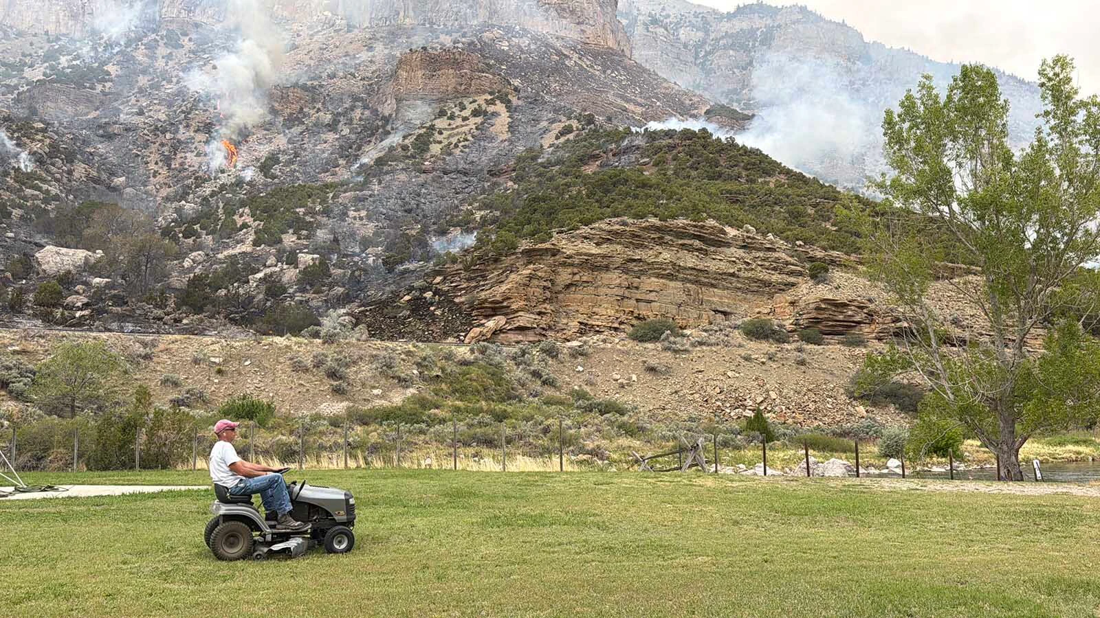 Mark Potter of the Wind River Canyon mowed his lawn once the emergency crews had arrived to put out the recent fire that threatened the canyon May 16. He is new to rural living and loves caring for the property that is so different from the busy life he was used to in Denver.