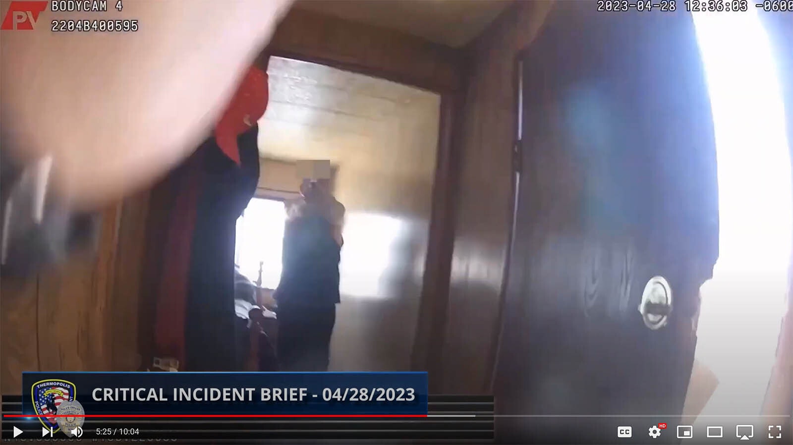 In this image from Thermopolis Police Sgt. Mike Mascorro's body cam on April 28, 2023, shows Mascorro being confronted by and armed Buck Laramore after breaking into Laramore's home intending to arrest him.