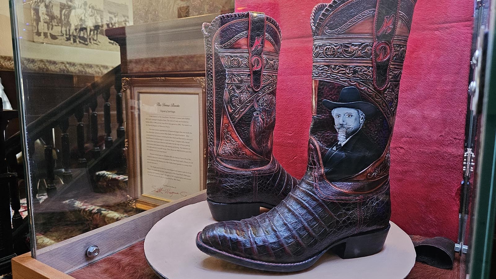 These boots, on display in the Hotel Irma, were a gift to owner Mike Darby. They include a picture of Buffalo Bill Cody, as well as a drawing of the Irma Hotel. Darby told Cowboy State Daily he's worn the boots only twice, for very special occasions.