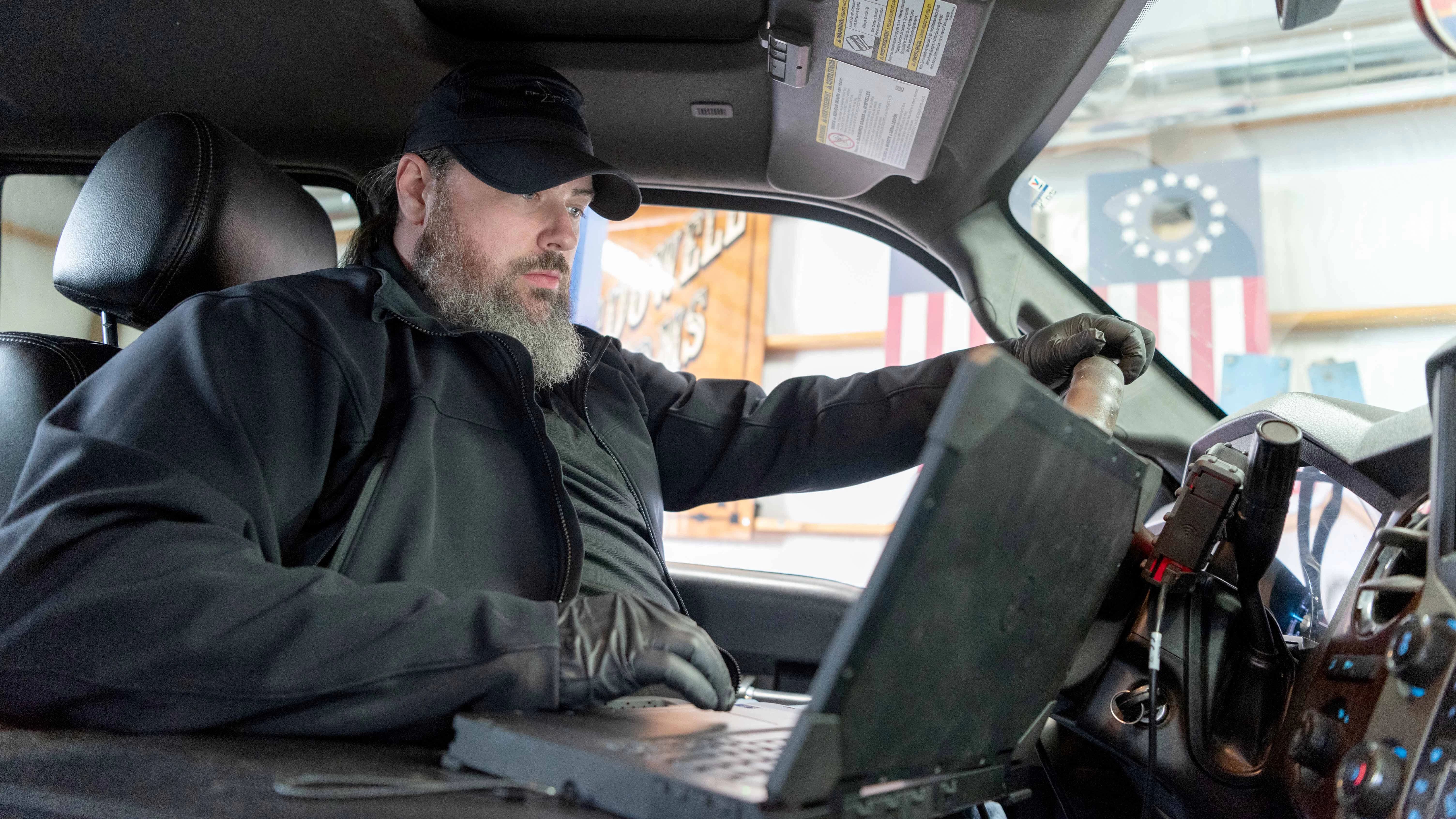 Matt Geouge diagnoses an electrical sensor problem with a truck.
