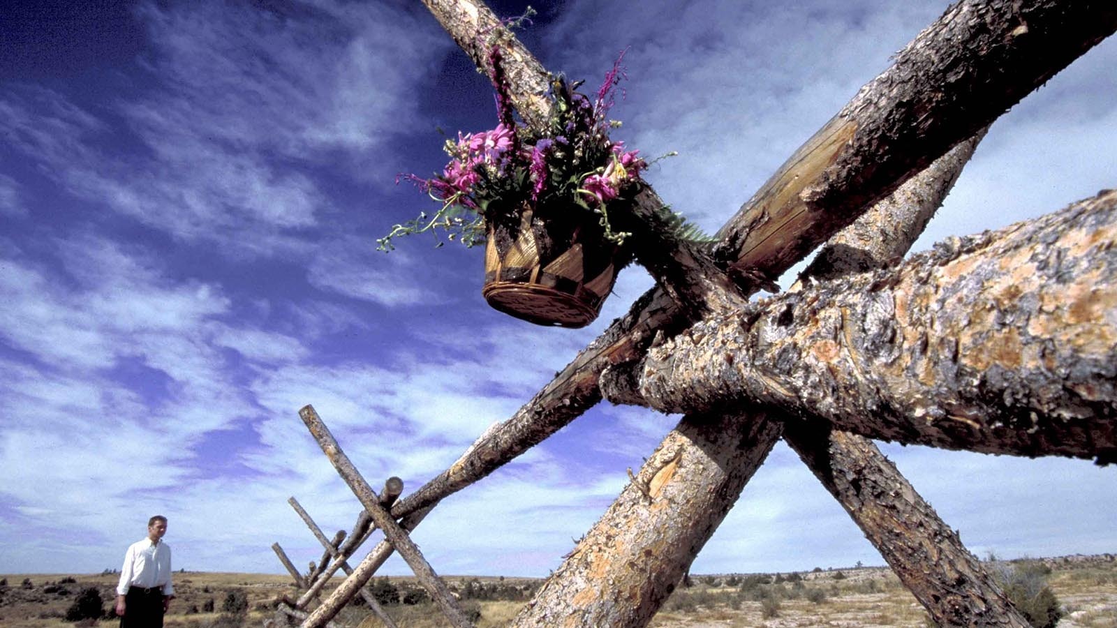 Basket of flowers hanging from fence where Matthew Shepard was left tied, beaten near death in a (later fatal) savage assault by Aaron McKinney and Russell Henderson.