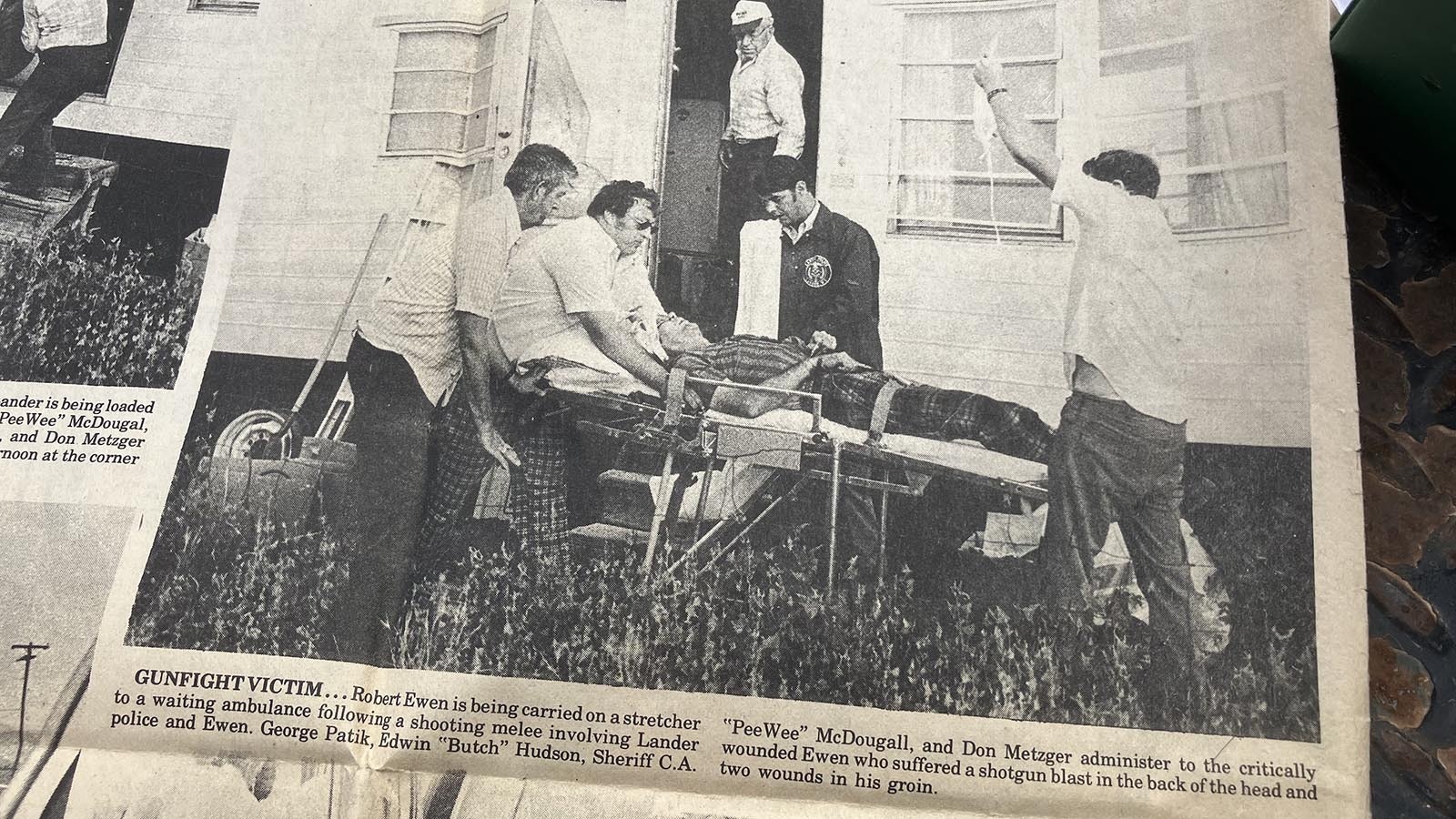 Tim McKinney’s assailant is carried out of a trailer in Lander.