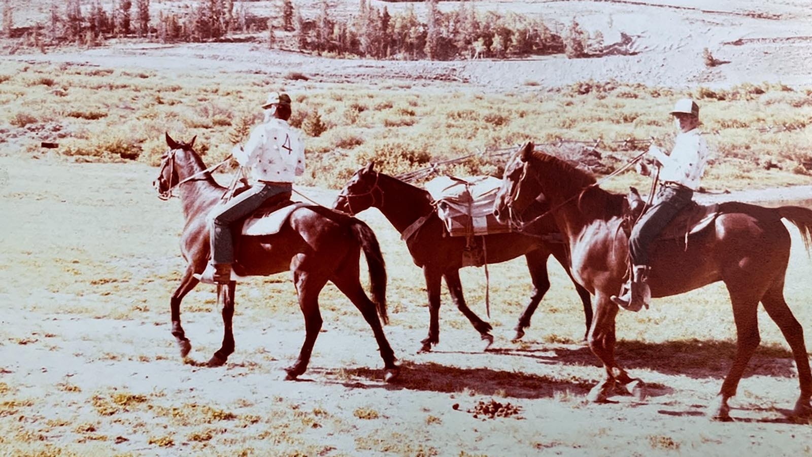 Tim McKinney, left, completes in a pack horse race with another officer. He said competed for a couple of years and won.