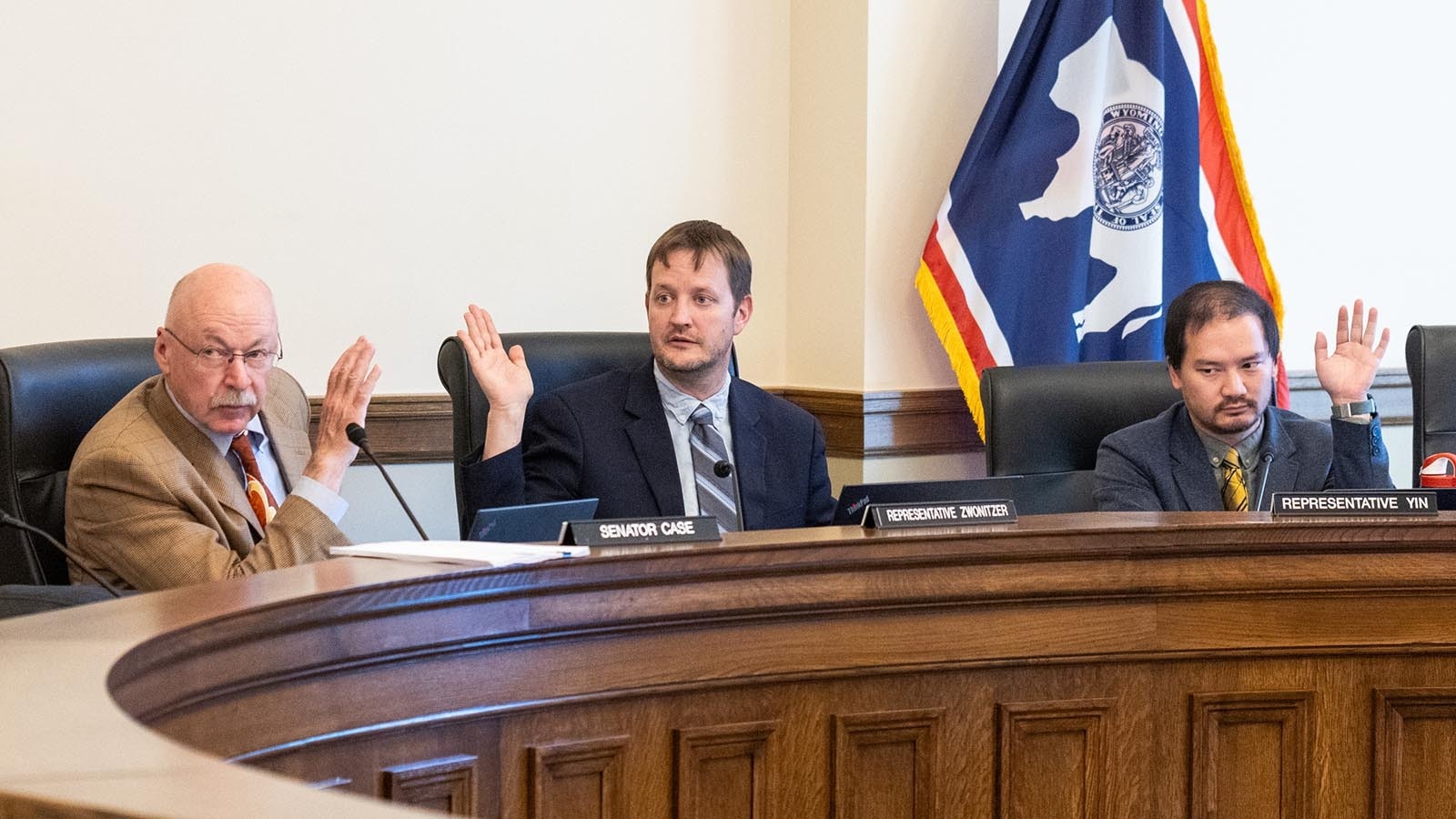 State Sen. Cale Case, R-Lander, from left, and Reps. Dan Zwonitzer, R-Cheyenne, and Mike Yin, D-Jackson, vote on allowing press in the hallways of the House and Senate chambers at the Wyoming Capitol.